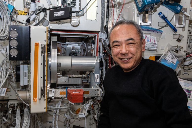 Astronaut Satoshi Furukawa Poses Next To Research Hardware - From Spacesuit Loop Scrubs To VR Therapy: Decoding A Day Of Science Aboard The ISS