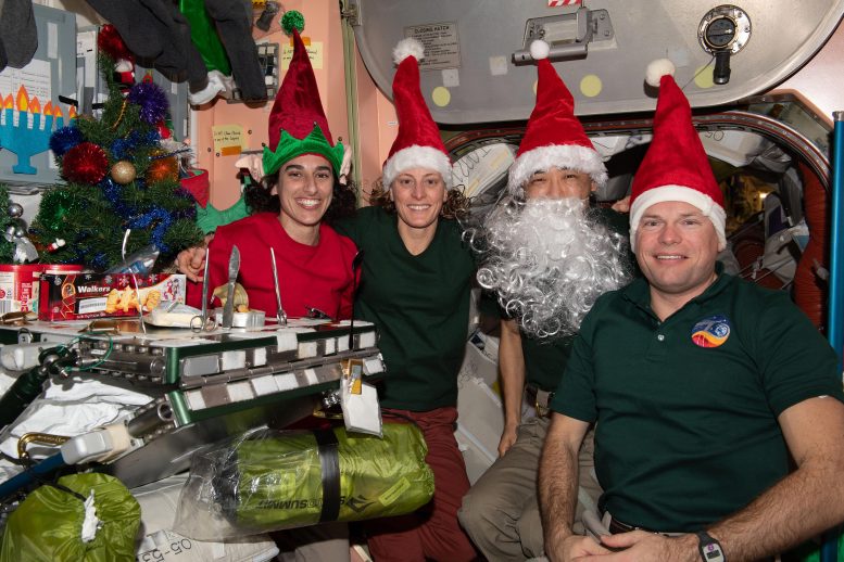 Four Expedition 70 Crewmates Christmas Eve Portrait - Gravity-Defying Research: Cosmic Coatings And Light-Speed Fibers On The Space Station