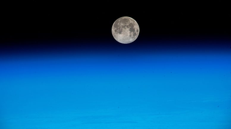 Near Full Moon Just Above Earth’s Atmosphere - DNA Decoding And Robot Rendezvous: The Latest Scientific Innovation On The Space Station