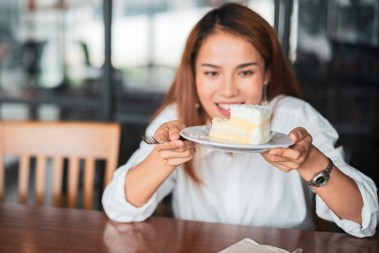 Young Woman Eating Cake - The Sweet Secret Of Fruit Bats: A Healthy Sugar Diet Unveiled