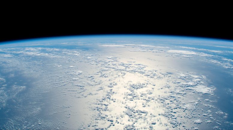 Sun’s Glint Beams off Tranquil Blue Atlantic Ocean - Innovations In Orbit: Cutting-Edge Biology And Fluid Physics Research On The Space Station