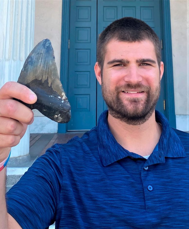 Phillip Sternes Holding Megalodon Tooth - The Megalodon Makeover: How Science Just Flipped The Script On The Ancient Shark