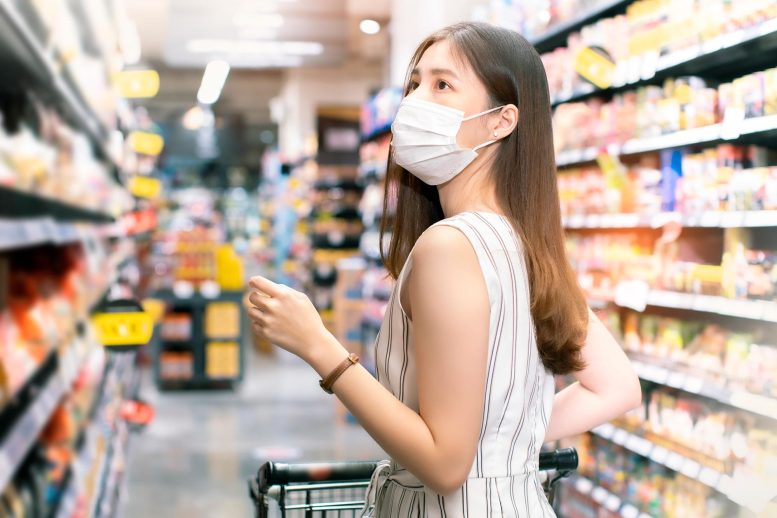 Woman COVID Mask Supermarket - The “Surprisingly Different” JN.1 Variant Is A Game-Changer In Our COVID Battle