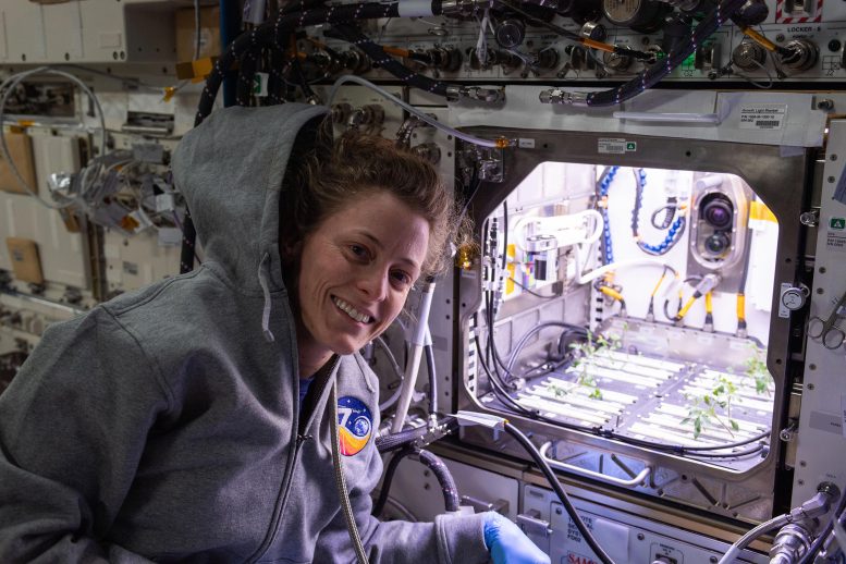 Astronaut Loral O’Hara Poses in Front of Advanced Plant Habitat - Astronauts Conduct Bone And Optical Fiber Studies As Ax-3 Crew Nears Departure From Station