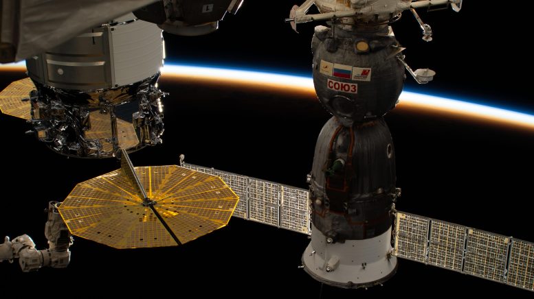 Last Rays of an Orbital Sunset Illuminate Earth’s Atmosphere From Space Station - Enhancing Immunity, Advancing Robotics, And Refining Optical Fibers In Space