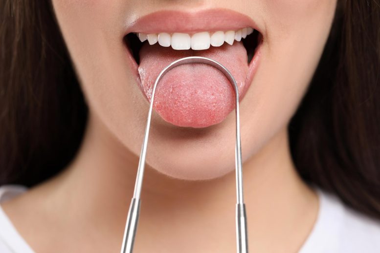 Woman Mouth Toungue Cleaner - Decoding The Deadly Link Between Oral Microbes And Cancer