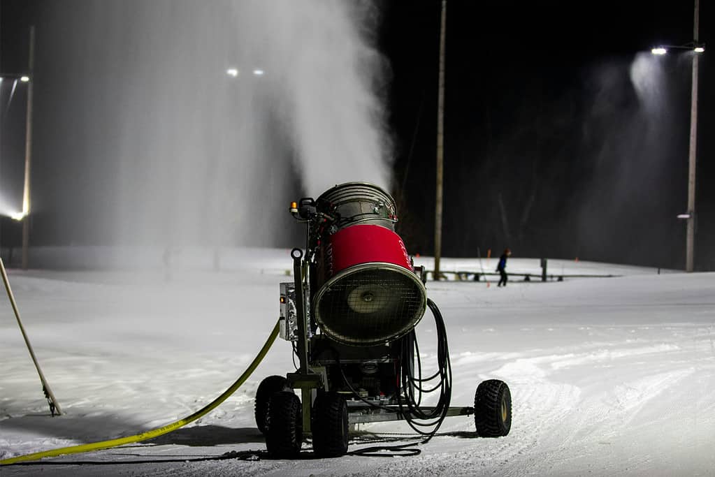 A snowgun spraying cold water and compressed air. Image credits: Aaron Doucett/Unsplash - Can Artificial Snow Save Ski Resorts Amid The Hottest Winters On Record?