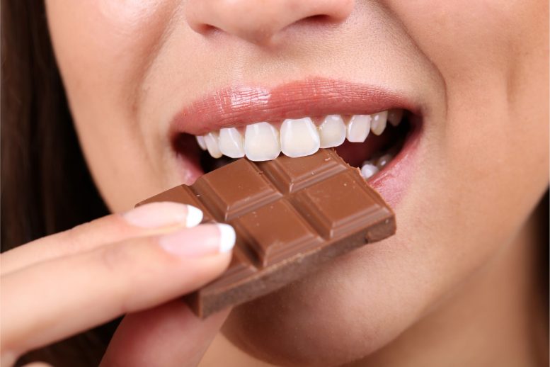 Woman Eating Chocolate - Cacao Crisis: Devastating Virus Threatens Global Chocolate Supply