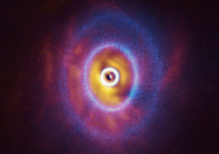 Astronomers may have detected a planet orbiting a triple star system