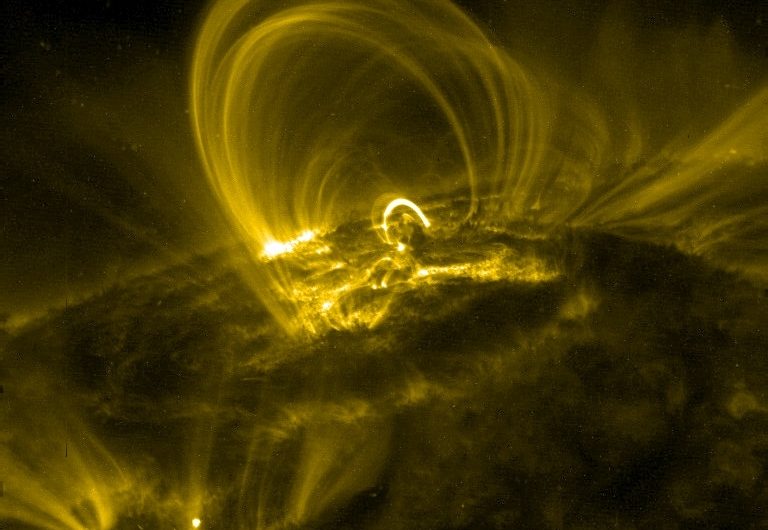 During a Solar Flare, Dark Voids Move Down Towards the Sun. Now We Know Why